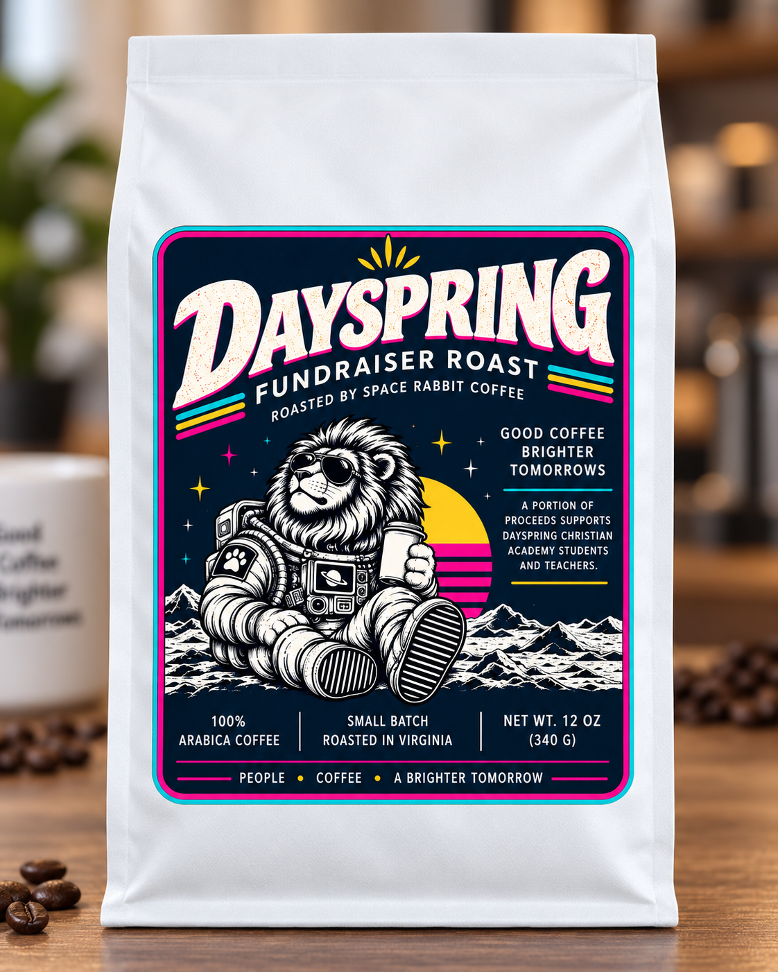Dayspring Fundraiser Roast white coffee bag with navy astronaut lion label